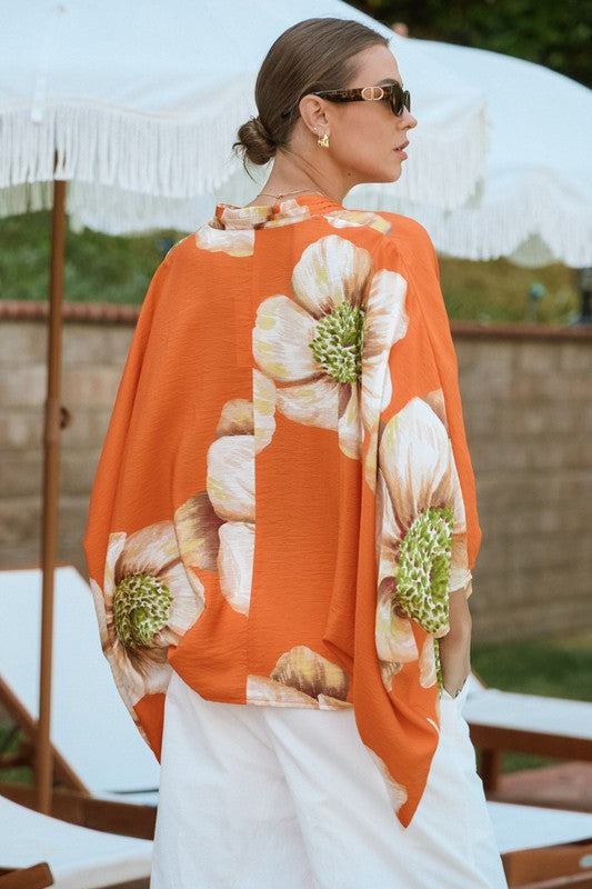 Orange floral batwing front wrap blouse