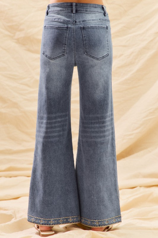 Mid rise embroidered hem jeans