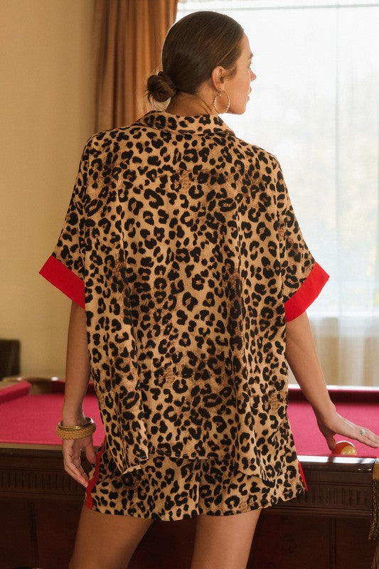 Leopard print short sleeve blouse with red trim