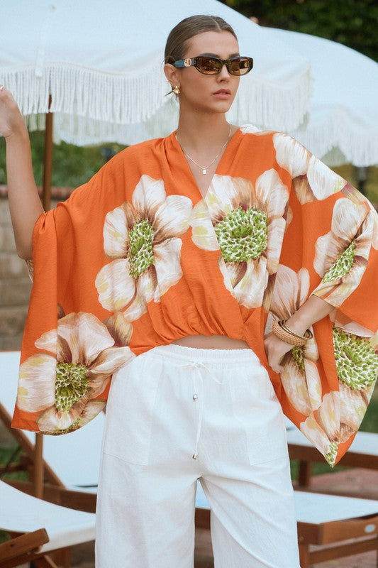 Orange floral batwing front wrap blouse