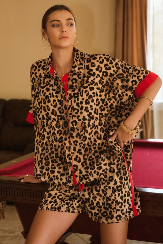 Leopard print short sleeve blouse with red trim