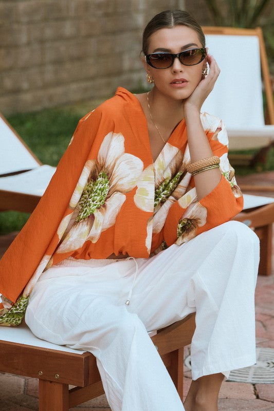 Orange floral batwing front wrap blouse