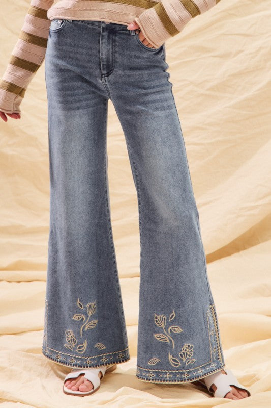 Mid rise embroidered hem jeans