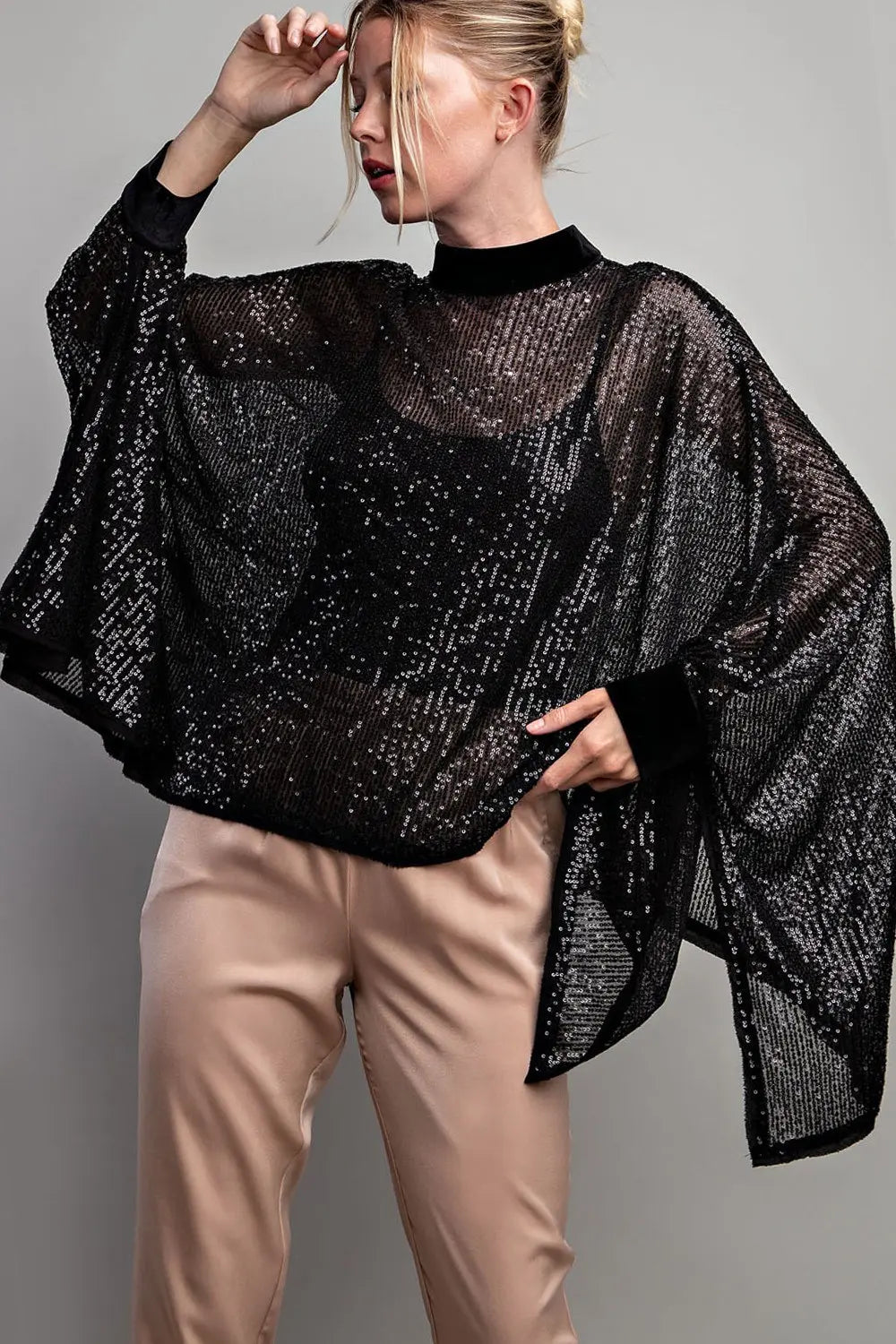 Black sequin poncho top with velour trim