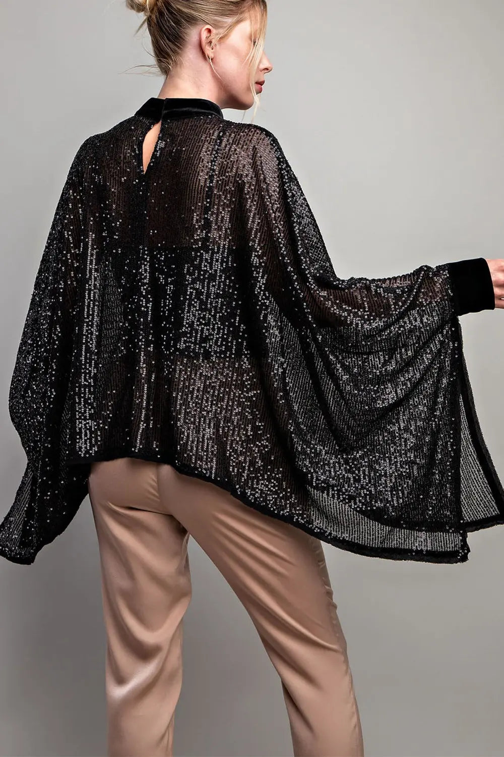 Black sequin poncho top with velour trim