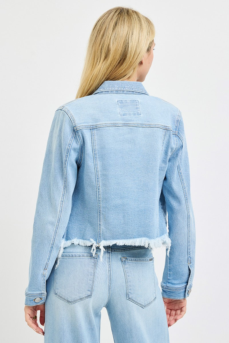 Frayed hem light wash denim jacket by Risen